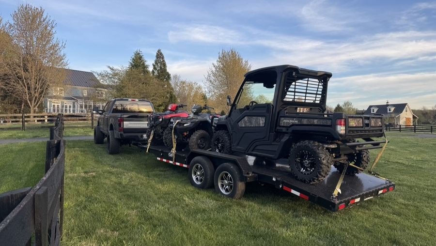 ATVs and UTV loaded on the car hauler trailer